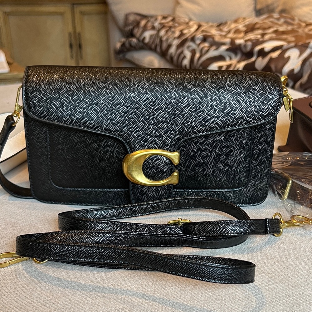 Like new Chic Black Crossbody Bag with Gold Accents, tabby style